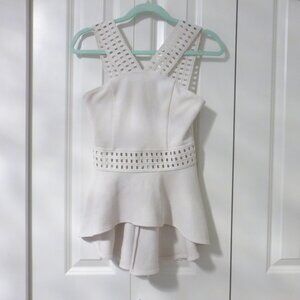 BEBE white peplum top with thick straps and small cut out details